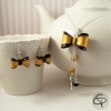 Boucles d'oreilles noeuds dorés