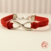 Bracelet avec symbole mouvement perpétuel et cordons rouges