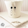 Boucles d'oreilles femme avec menotte et clé