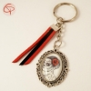 Porte-clef Catrina dans médaillon en verre