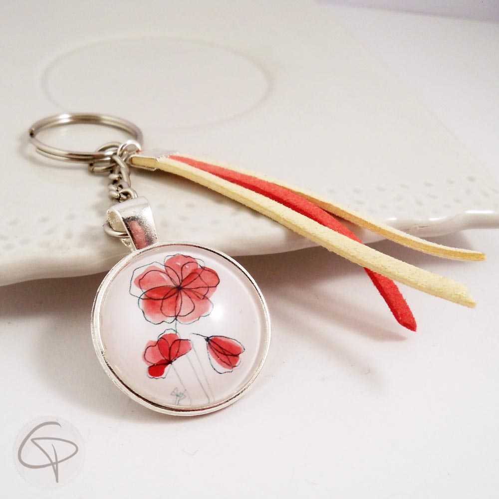 Porte-clé avec médaillon dessin de fleurs de coquelicot